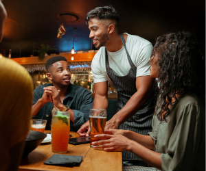 Waiter serving drinks